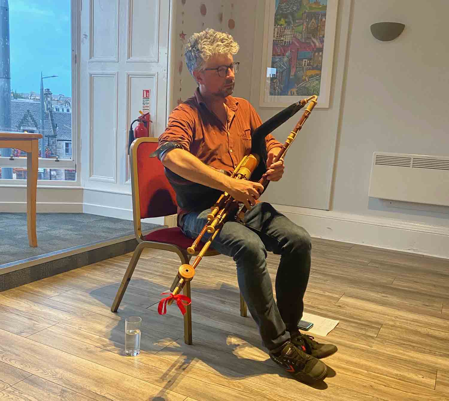 Jarlath Henderson performs on a 3/4 set of uilleann pipes at the Eagle Pipers Society in Edinburgh.