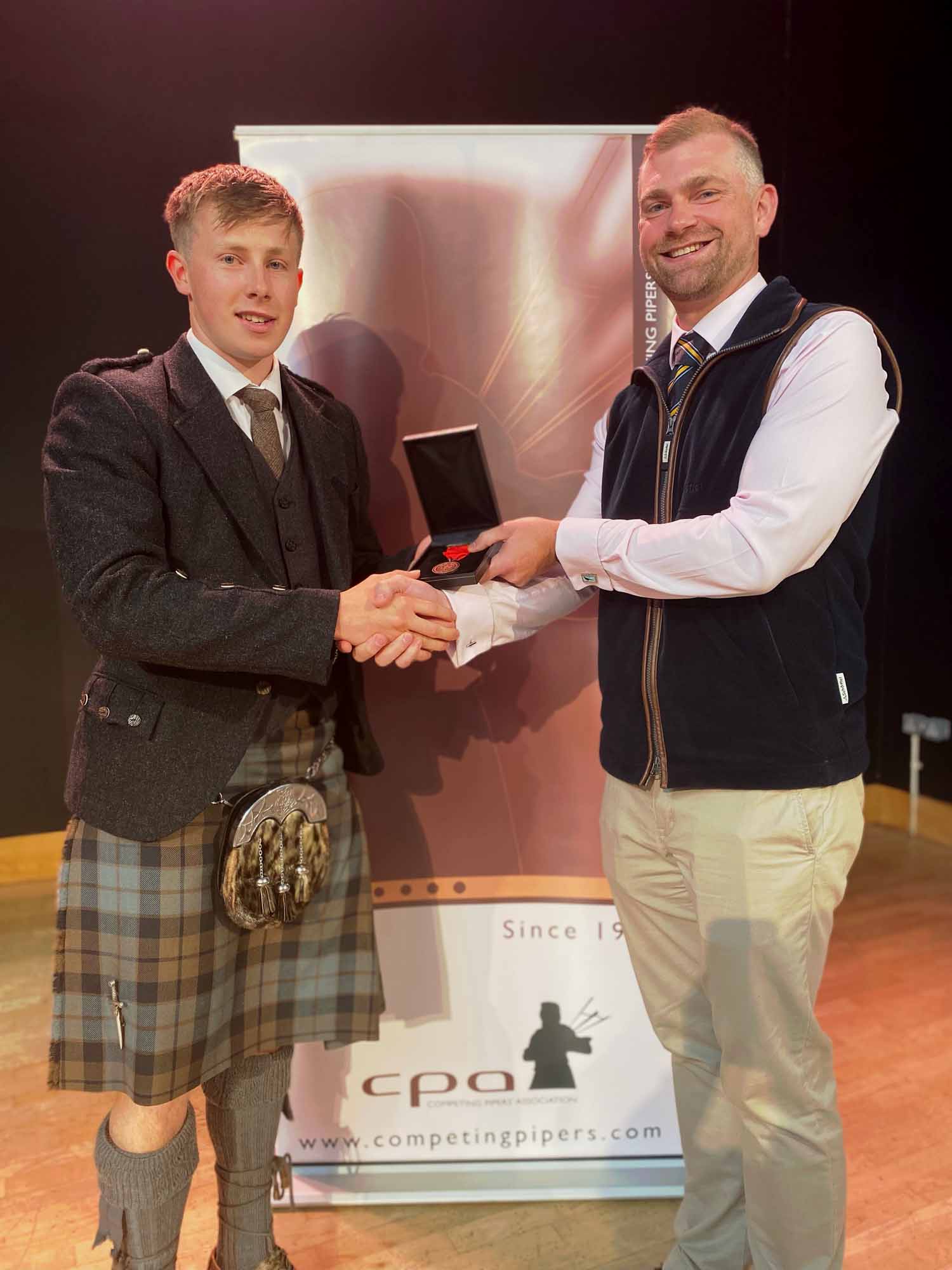 Awarding the first-ever CPA Bronze Medal to Luke Kennedy, 2023.
