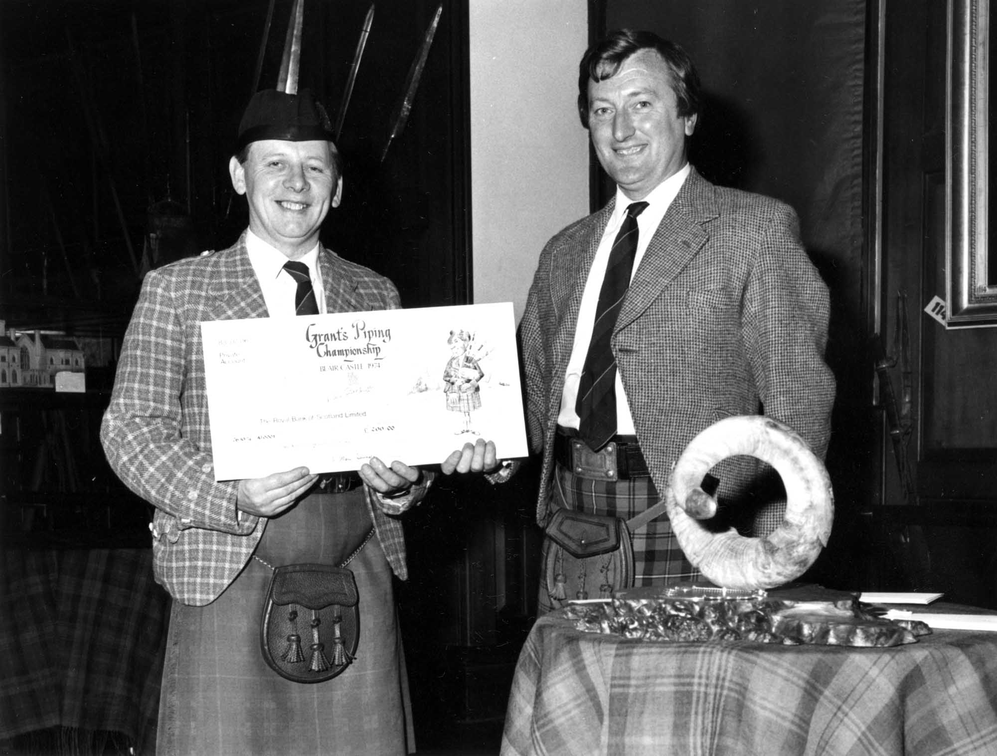 Jimmy McIntosh gets his winnings in 1974.