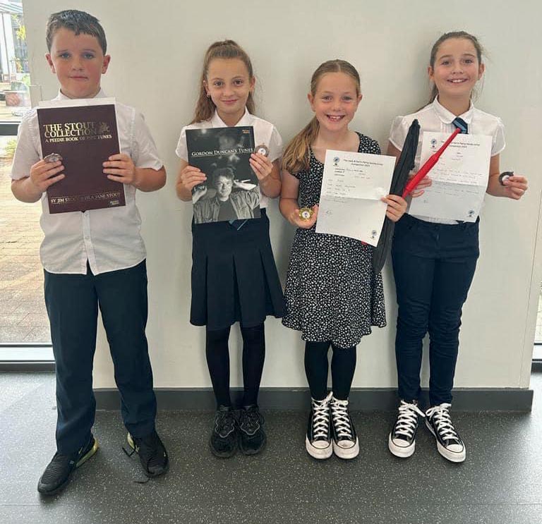 Happy participants (L-R) Callum MacDonald, Sarah MacDonald, Patricia Mallon, and Katie MacRury at the 2023 Islands Junior Solo Piping Competition.