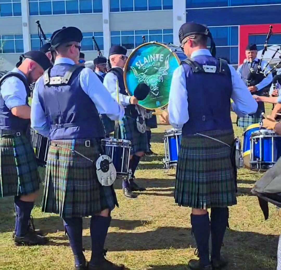 Slainte Social Club's drum section, the whole band now kitted-out.