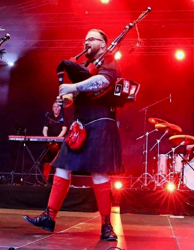 Callum Douglas performing with the Red Hot Chilli Pipers
