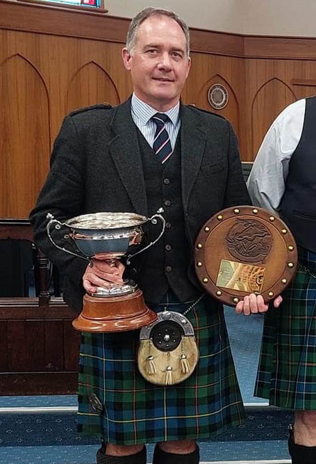 Greg Wilson with some of the same trophies he won at Hastings in 2024.