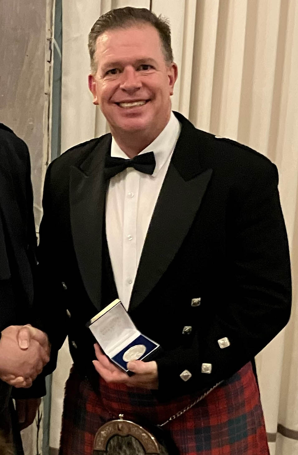 Ian K. MacDonald with the 2024 Capt. John MacLellan Memorial Medal for piobaireachd