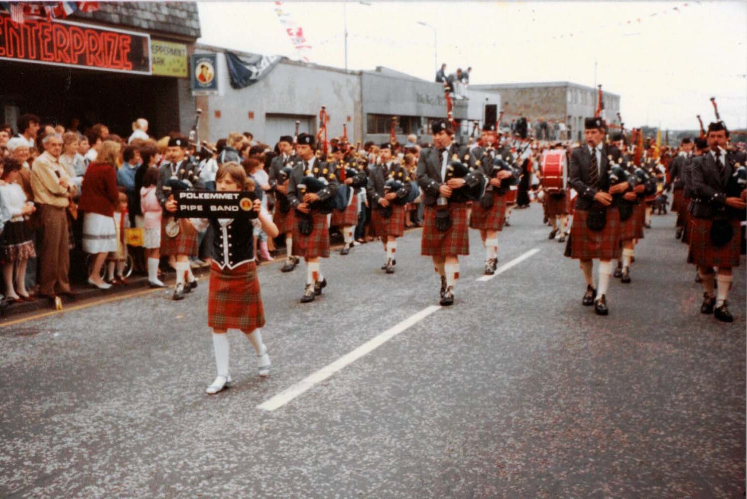 Polkemmet Colliery on the march, Whitburn Gala Day 1984. L-R: P-M Robert Mathieson, Ian Morris, Iain Wilson, Andy Craig, Gordon Stafford, Robert Tait, Andrew Berthoff, P-S Ian Roddick.