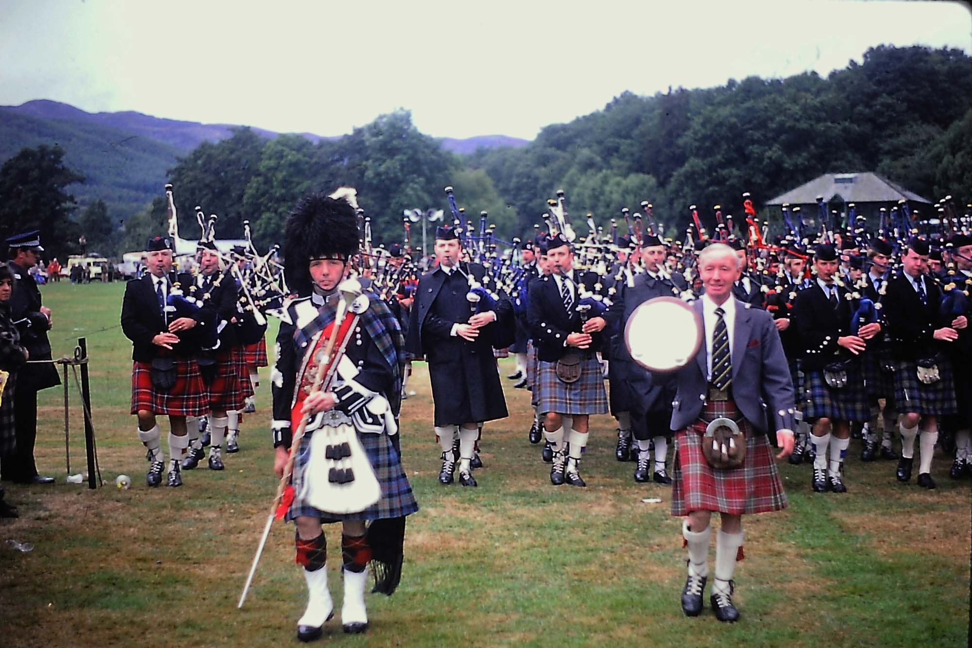 Pitlochry 1984. Polkemmet committee chair Matt Morrow with the first place trophy. Legendary Strathclyde Police Pipe-Major Iain MacLellan is far left. Boghall & Bathgate Caledonia Pipe-Major Robert Martin is visible just to the left of Morrow.