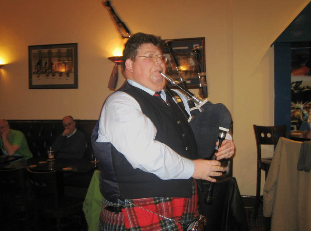 Performances by top-flight pipers are frequent at meetings. Here, Highland Society of London Gold Medallist Donald MacPhee has a tune.