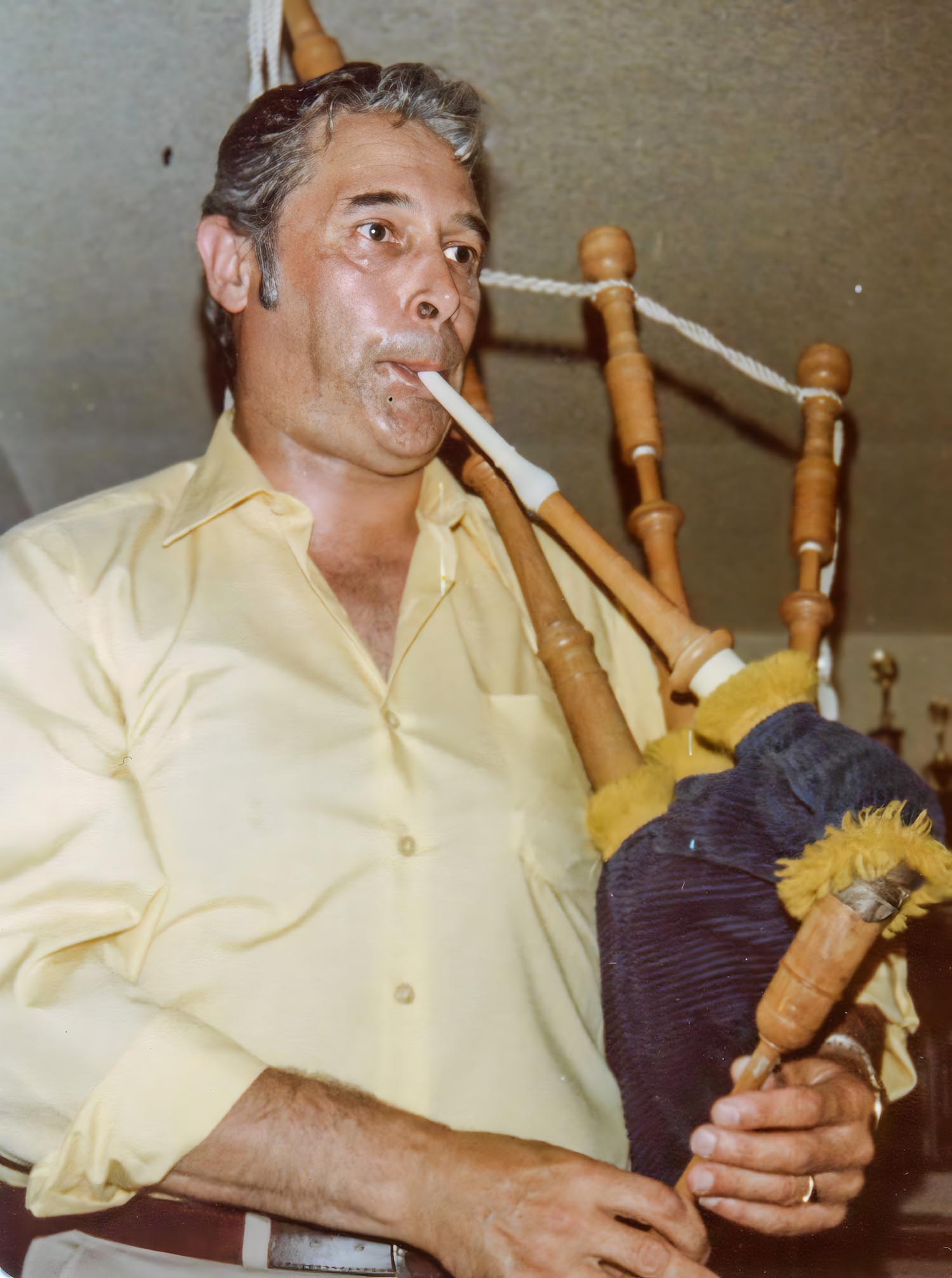 Playing a set of maple wood Sinclair pipes, c1980