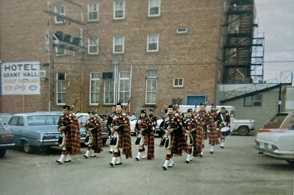 The Regina Boys and Girls Pipe Band (later the Fraser Pipe Band) playing in Moose Jaw, probably during the Kinsmen International Band Festival, which had a pipe band and solo piping and drumming component.