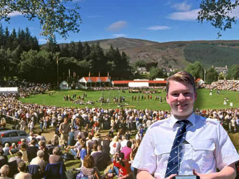 Cameron Bonar with piping royalty winning overall trophy at Braemar Highland Gathering