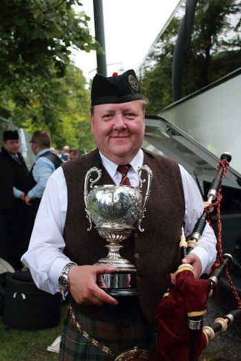 Kenny MacLeod, 2013, with one of Glasgow Skye's many Grade 2 trophies under his leadership.