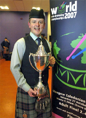 Barry Wilson with one of his four World Solo Drumming Championship trophies