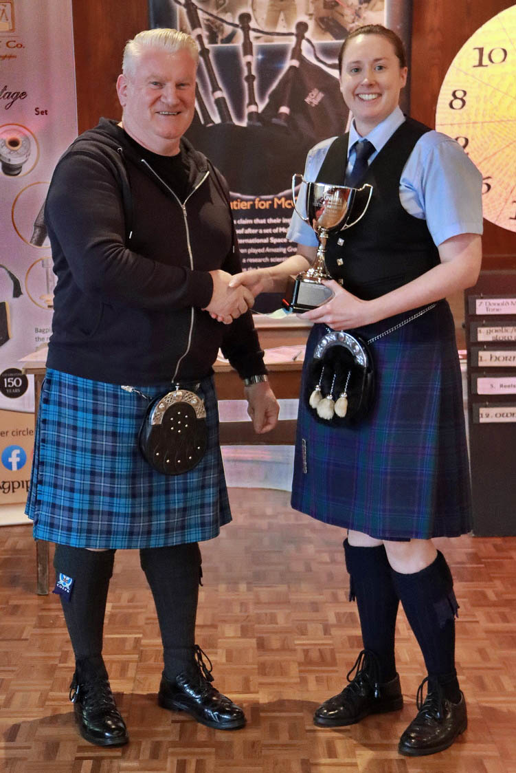 City of Edinburgh Pipe-Major David Clunie congratulates Sarah Muir on her 2025 Pipe-Major's Wheel of Fortune victory.