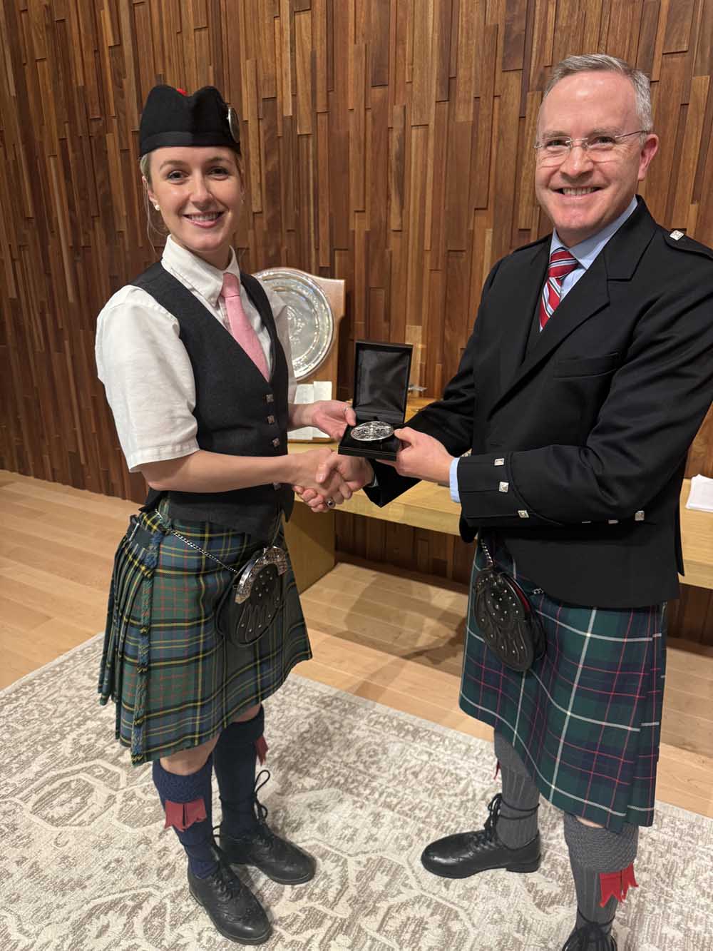 Olivia Corcoran received the Seumas MacNeill Silver Quaich from Mike Rogers