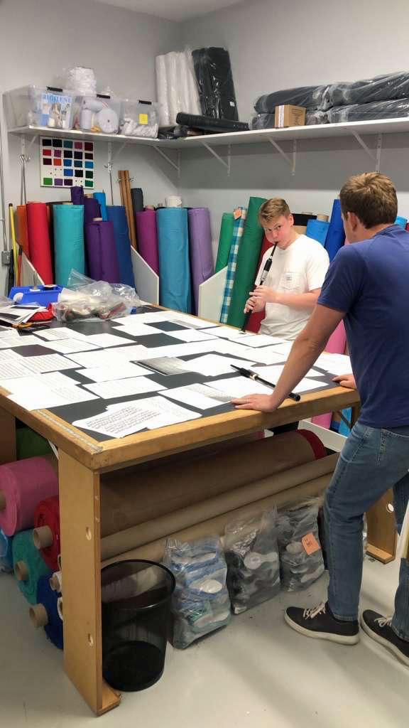 Pipe-Sergeant Craig Sutherland and piper Cameron Bonar sewing together medley ideas at Tartantown.
