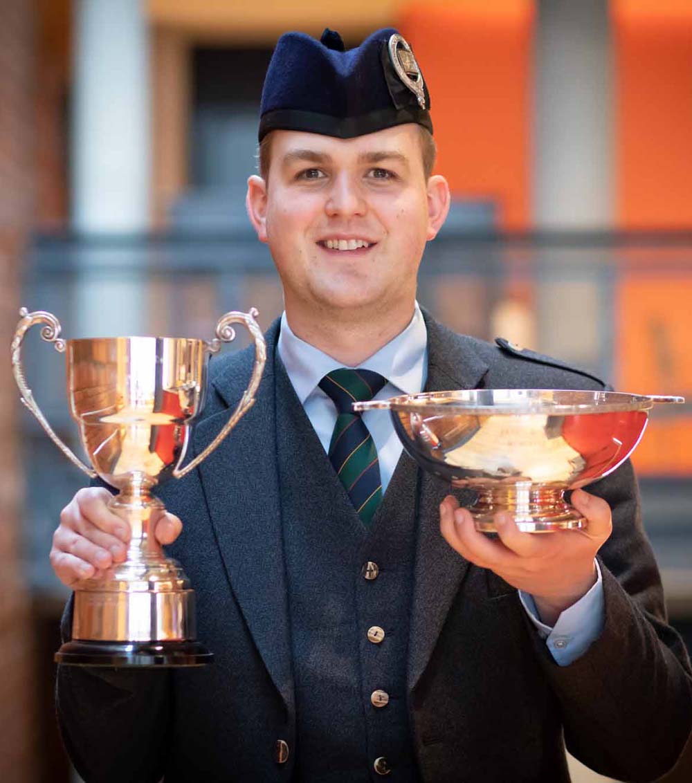 Craig Sutherland with 2022 Royal National Mòd trophies.