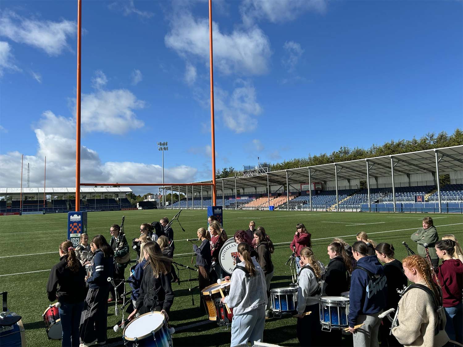 Scottish Schools Pipes & Drums Trust all-girls pipe band practicing at Murrayfield