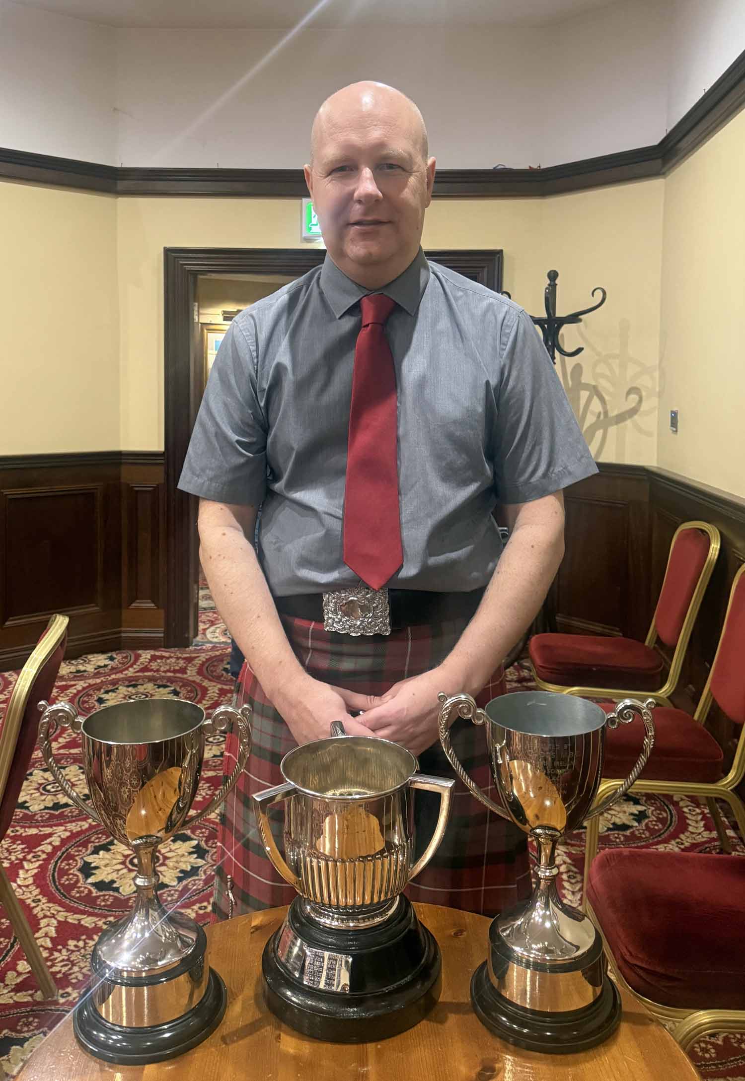 Ashley McMichael with his 2026 Northern Ireland Piper of the Year trophies.