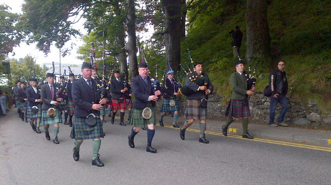 Solo pipers traditionally march to the Thursday games at Oban, with the Gold Medallist taking the pipe-major role, here Douglas Murray in 2014.