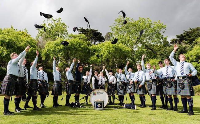 The host Novice Juvenile Wynberg Boys Pipe Band celebrate just playing at their event.