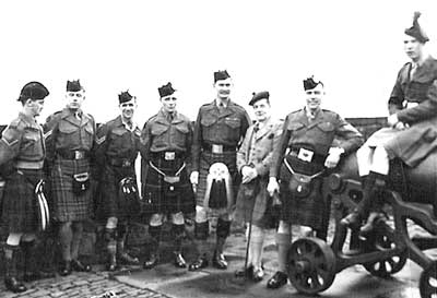 <em>Pipe-Majors' Course, Edinburgh Castle, 1950. L-R: L/CPL George Johnston, Cameron Highlanders; Cpl. Sandy Hain, Black Watch; Cpl. Tom Shearer, Argyll & Sutherland Highlanders; Cpl. Peter Forbes, Highland Light Infantry; P-M Bob Crabb, Scots Guards; Bobby Cuthbertson; Cpl. G. Symon, Gordon Highlanders; and L-Sgt. Ramsay, Irish Guards.</em>