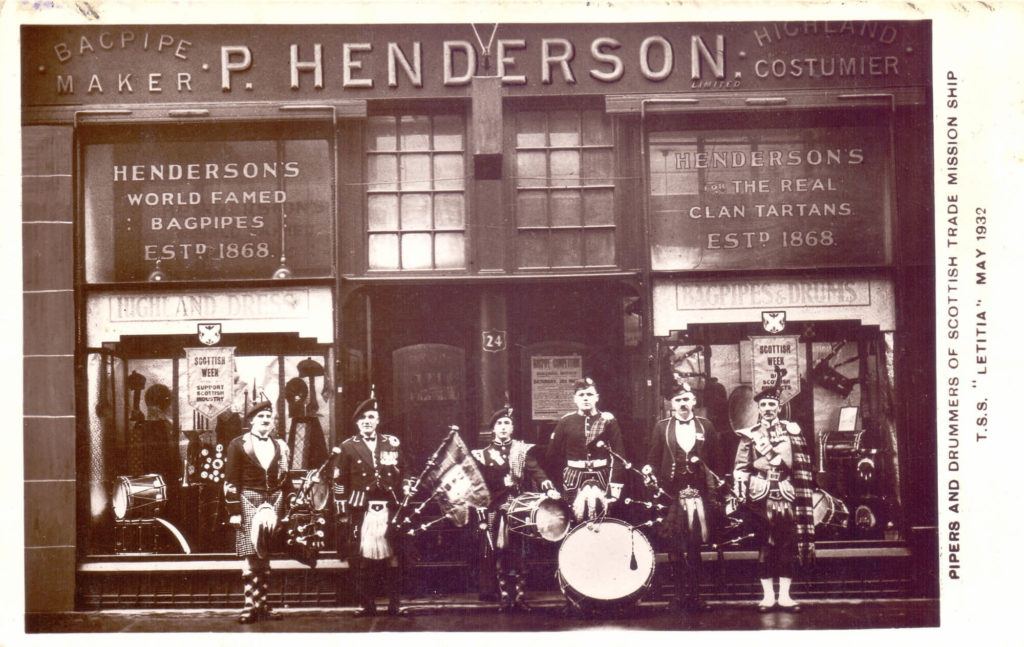 Pipers and drummers gathered in front of the Peter Henderson shop at 24 Renfrew Street, Glasgow, before a trade mission to Canada aboard the ship Letitia, 1932.