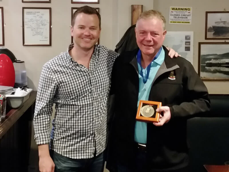 78th Fraser Highlanders Pipe-Major Doug MacRae presents the band's first Honourary Lifetime Membership to 30-year piper Bruce MacLean at the Park Bar, Glasgow.