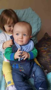 Jack Cowan with his older sister now.