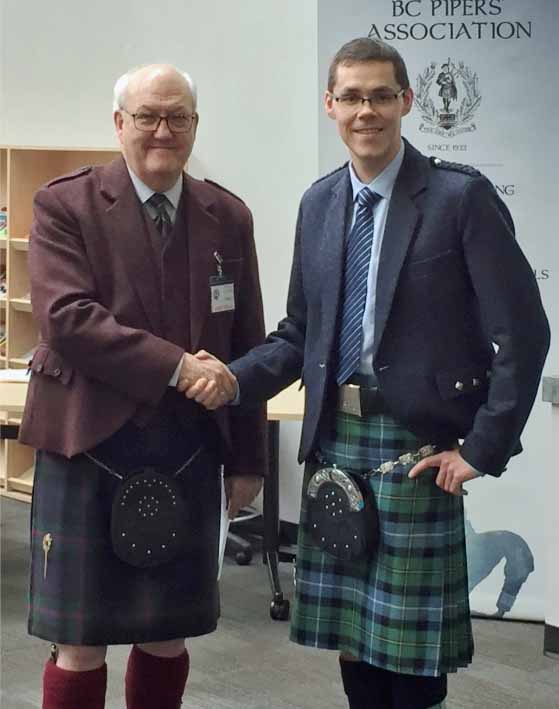Zephan Knichel (right) with Senior SPJA judge John Wilson after winning the 2020 Silver Medal qualifying competition in British Columbia.