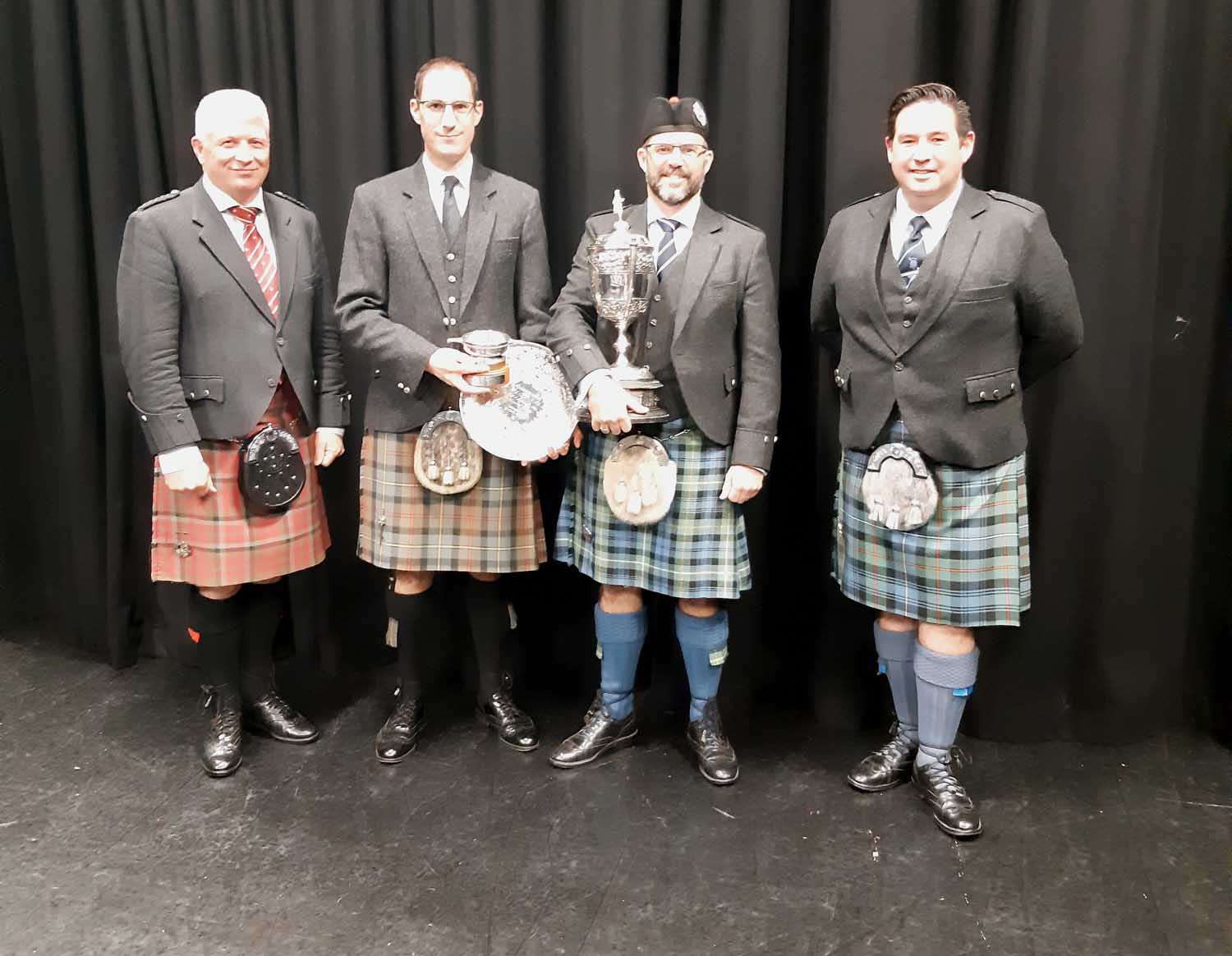 Richard Hawke, judge; Malcom Galloway, president of the Wellington Pipers Club; Brown Cup & Everest Piobiareachd winner Brendon Eade; and Iain Robertson, judge at the 67th annual competition.