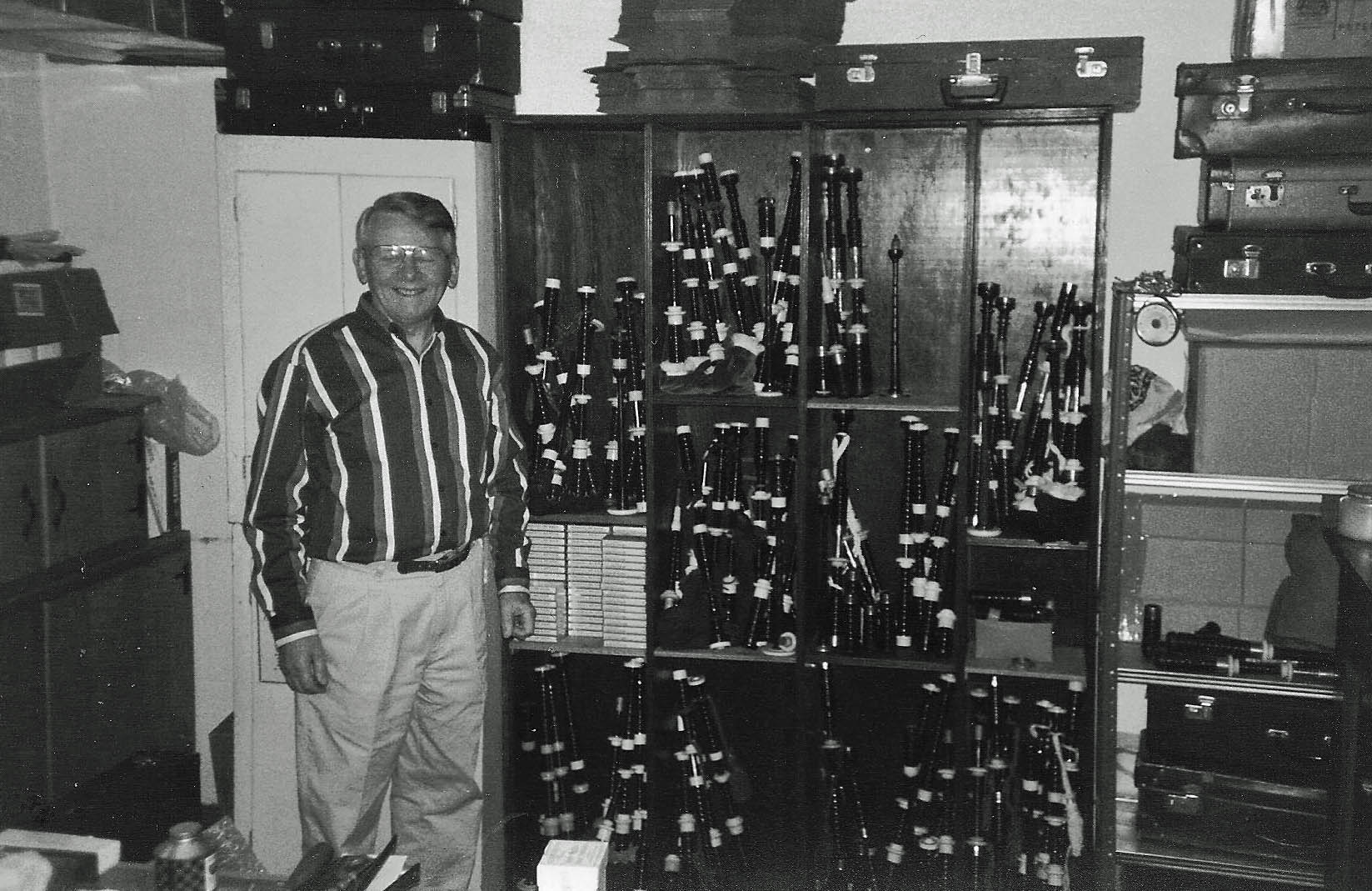 Jimmy McIntosh in 1994 at his home in Pittsburgh with his inventory of vintage instruments for sale to willing buyers around the world.