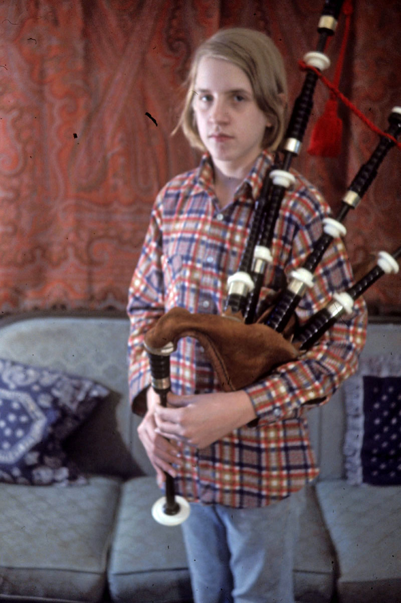 The unimpressed author in 1976, with his first set of pipes, made by R.G. Hardie, but with an unplayably stiff cowhide bag.