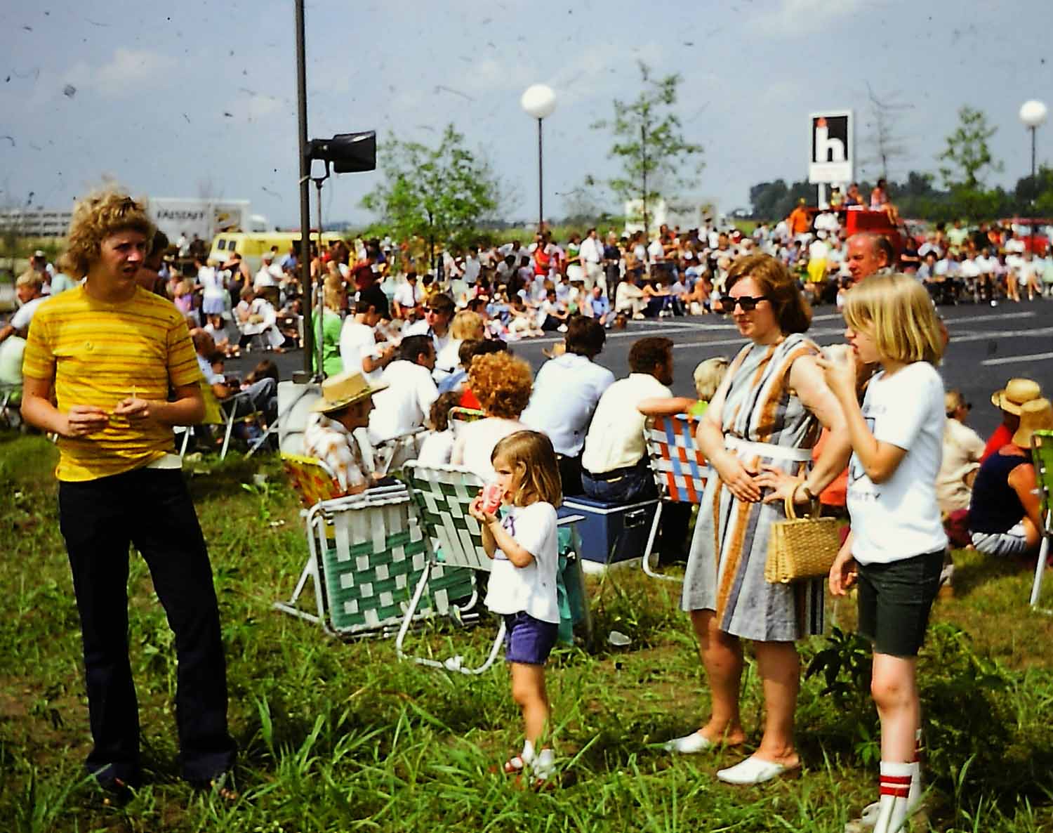 Within a few minutes officially starting a piping life, the author is far right, his brother, Tom, at far left, younger sister, Clarissa, and mother taking in the pipe bands melting on the tarmac.